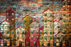 Mural of apartment housing on a brick wall.